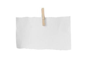 Wooden clip and white paper torn isolated on white background. Object with clipping path photo