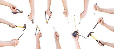 Collection of hands holding mechanic tools isolated on white background, with clipping path. photo