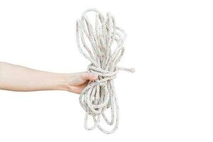 Hand holding rope isolated on a white background. Object with clipping path. photo