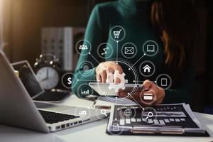 business documents on office table with smart phone and digital tablet and graph financial and man working photo