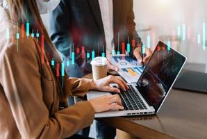 wo stock traiders making analysis of digital market and investment in block chain crypto currency. photo
