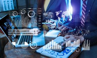 Intelligence  and business analytics with key performance indicators dashboard concept. Two business colleague web designer discussing data and digital tablet photo