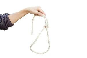 Hand holding rope isolated on a white background. Object with clipping path. photo