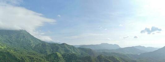 mountains under mist in the morning. panoramic picture. photo