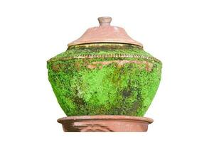 Old earthenware with moss isolated on white background. Drinking water container. Object with clipping path. photo