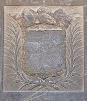 old coat of arms on the wall in the cathedral of Beziers photo