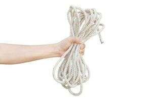 Hand holding rope isolated on a white background. Object with clipping path. photo