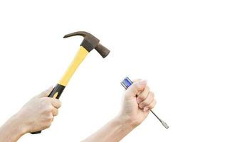 Male hands working with old rusty hammer and flat screwdriver isolated on white background with clipping path. photo