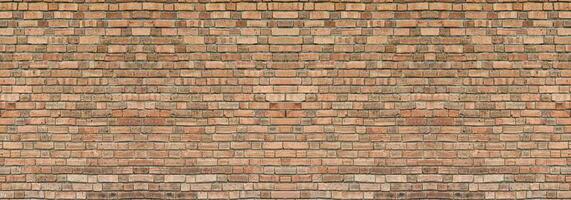 Dark brown old bricks wall panorama. Abstract brick texture for design or wallpaper. photo