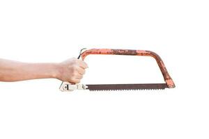 Hand holding old rusty bow saw isolated on white background with clipping path. photo