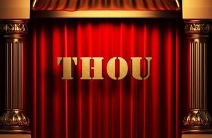 thou golden word on red curtain photo