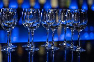 Empty wine glasses. Glasses for drinks in blue lighting. photo