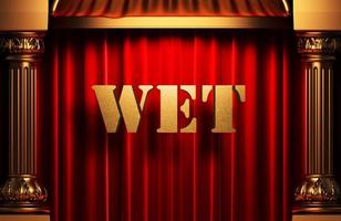 wet golden word on red curtain photo