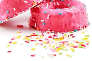 Strawberry donuts with chocolate shavings color on white background.Horizontal image. photo