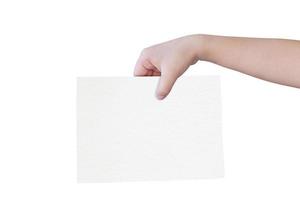 Child hands holding empty white paper isolated on white background with clipping path. Copy space for text. photo