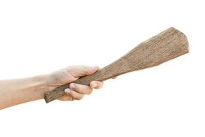 Hand holding old wooden ladle, Isolated on white background with clipping path. photo