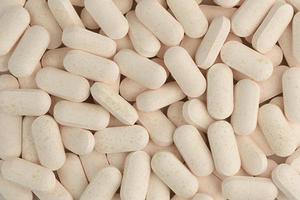 Pills close-up background. Macro shot. Medicine pattern. photo