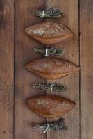 Three pieces of rye bread with herbs top view with copy space. photo