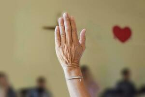 Christian worship of raised hand or pray in the church. photo