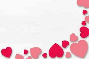 Red paper hearts on white wooden background. Valentines Day concept.