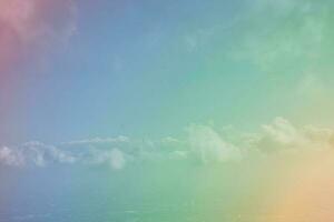 Sunshine clouds sky with a pastel soft color. Abstract blurred cyan gradient of sky nature. photo