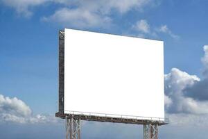 Billboard blank against blue sky background for outdoor advertising poster. photo