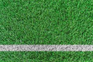 Top view of white stripe on green soccer field