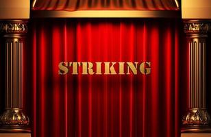 striking golden word on red curtain photo