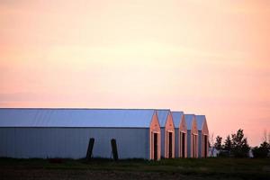 Setting sun lighting up buildings in scenic Saskatchewan photo