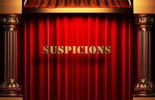 suspicions golden word on red curtain photo