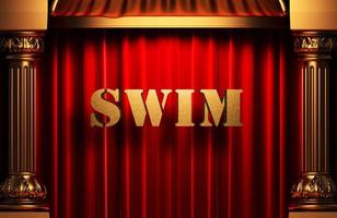 swim golden word on red curtain photo