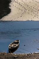 Boat on shore of Medicine Lake in Jasper National Park Alberta photo