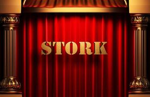 stork golden word on red curtain photo