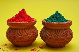 Indian festival Holi concept Multi color's bowl with colorful background. photo