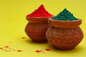 Indian festival Holi concept Multi color's bowl with colorful background. photo