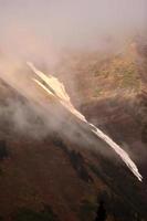 Low clouds over Bear Glacier National Park in B C photo