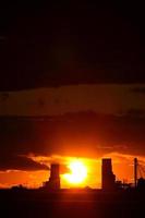 Sunset behind two Saskatchewan grain elevators photo