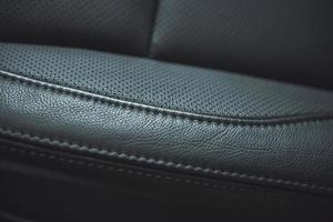 Leather background Part of car seat. Macro photo