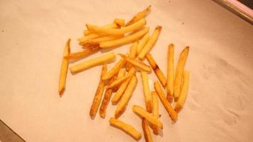 Close-up of Hands taking French Fries Potato from a Table video