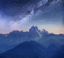 Fantastic starry sky. Snow-capped peaks. Main Caucasian Ridge. Mountain View from Mount Ushba Meyer, Georgia. Europe photo