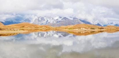 Clouds on mountain lake Koruldi. Upper Svaneti, Georgia, Europe. Caucasus photo