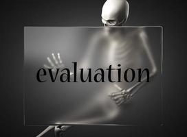 evaluation word on glass and skeleton photo