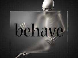 behave word on glass and skeleton photo