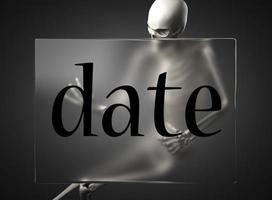 date word on glass and skeleton photo