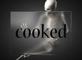 cooked word on glass and skeleton photo