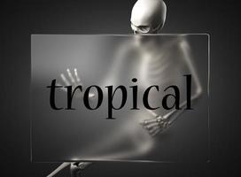 tropical word on glass and skeleton photo