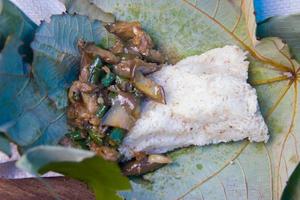 simple food using a leaf base, typical of the Kalimantan Dayak tribe photo