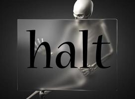 halt word on glass and skeleton photo