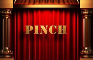 pinch golden word on red curtain photo