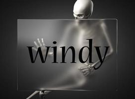 windy word on glass and skeleton photo